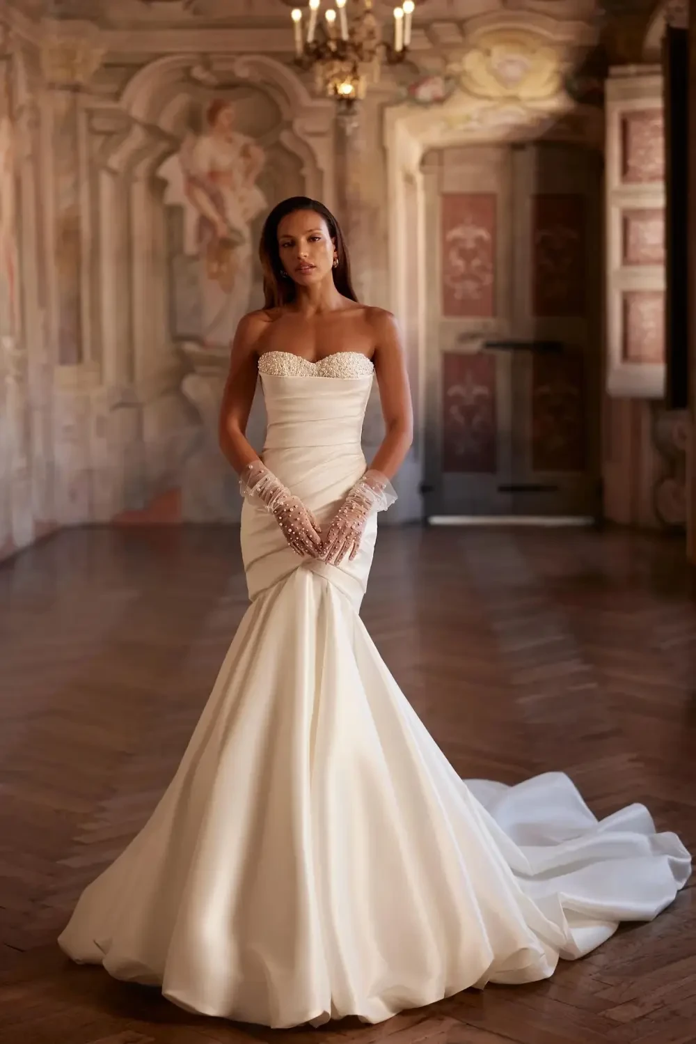 model is wearing a strapless wedding gown