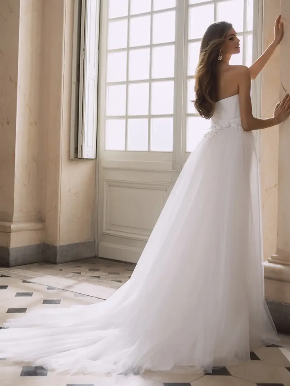 model is wearing a strapless bridal gown